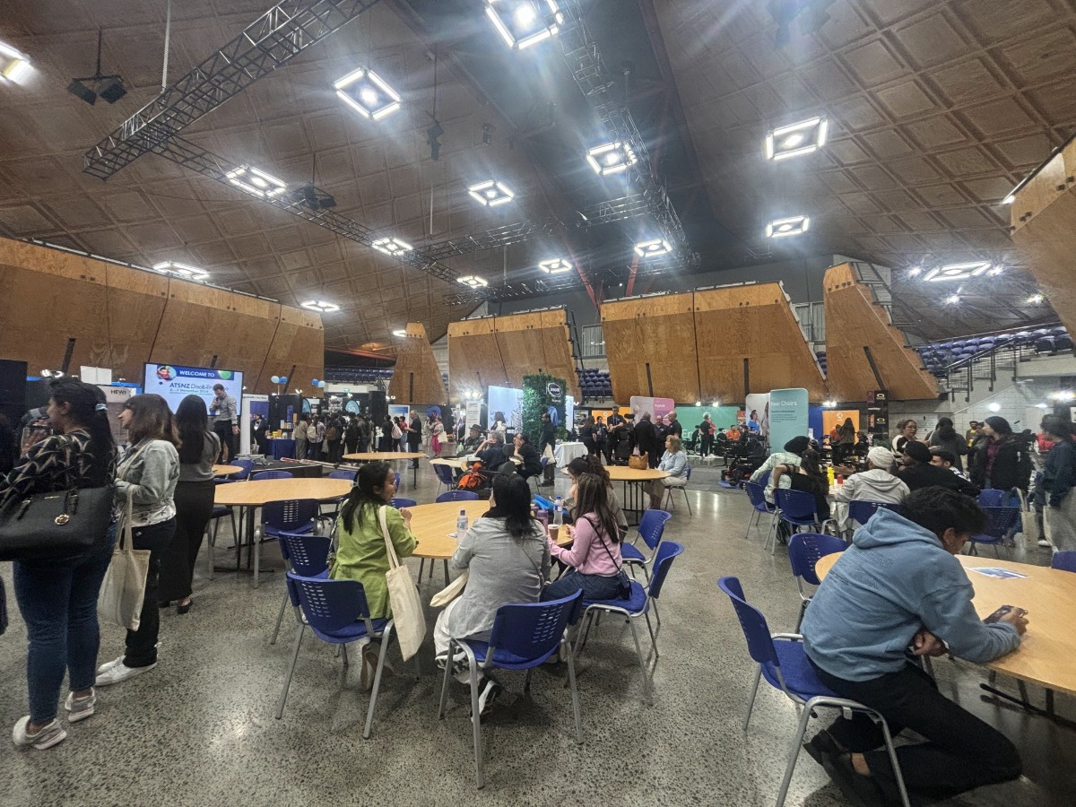 Another angle of the Expo Hall - attendees, booths