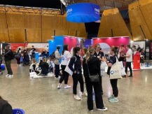 Students talking infront of booths in the Expo Hall