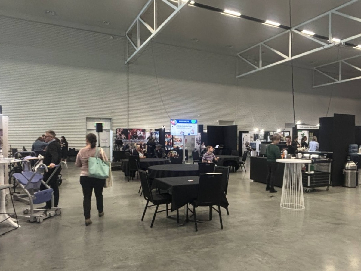 Another angle of the Expo Hall - attendees, booths