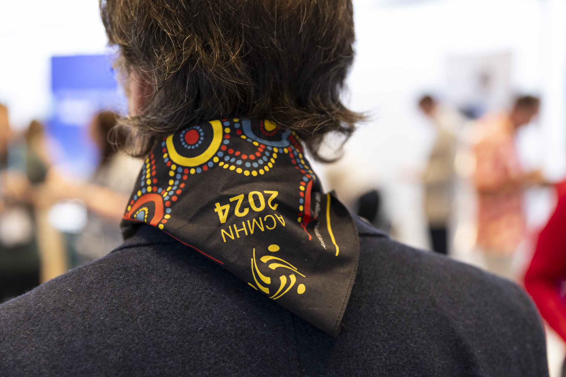 Person wearing the ACMHN 2024 bandana.