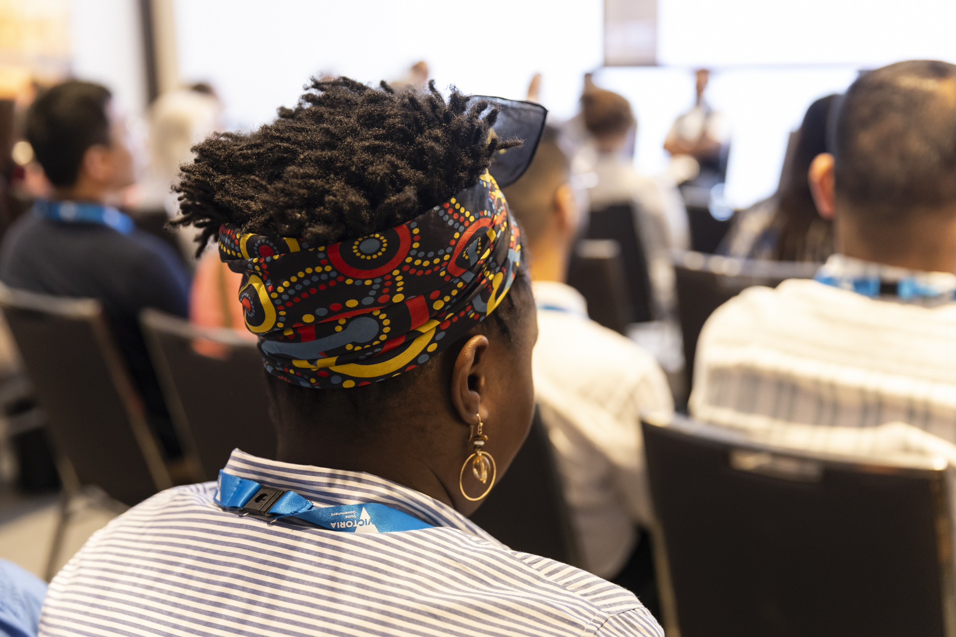 Person wearing the ACMHN 2024 bandana.