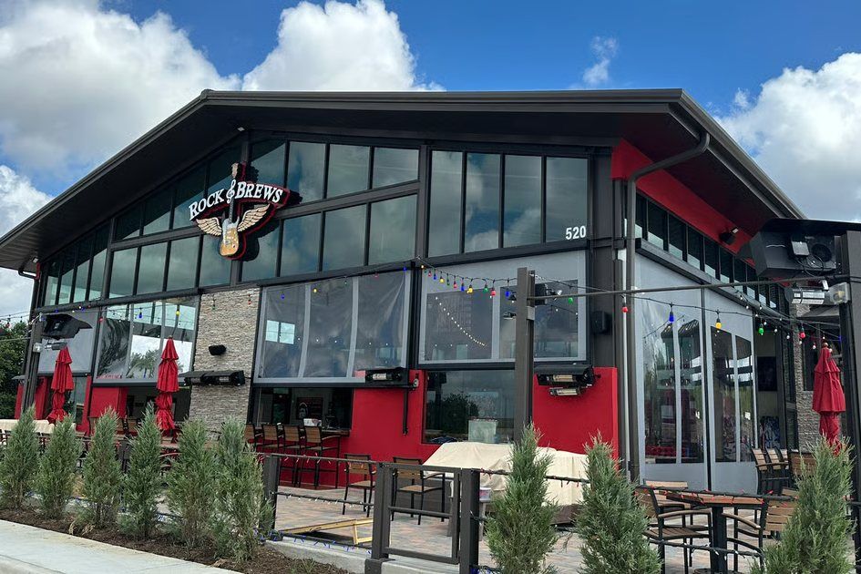 Rock & Brews in Grapevine, with its glass front, red accents, and string-lit patio