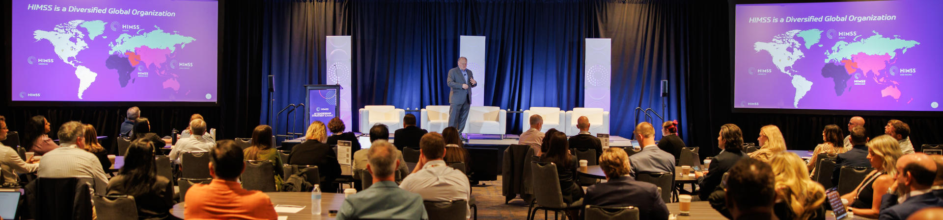 Hal Wolf presenting to healthcare leaders at AI Leadership Summit