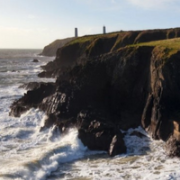 In this image is a cliffside, depicting costal change