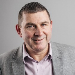 Headshot image of Nigel Pearce